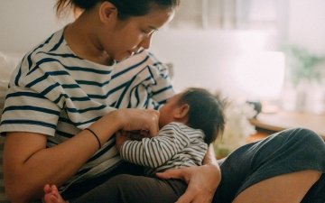 Woman breastfeeding child