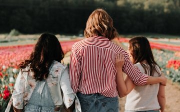 Three women walking outside