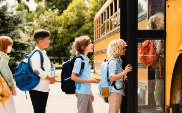 Children getting on a school bus