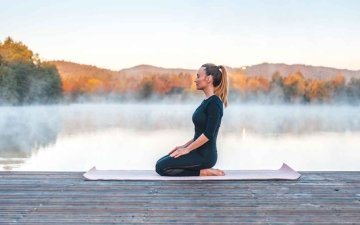 Woman doing yoga outside for wellness