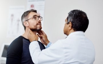 Male patient at check up with his doctor