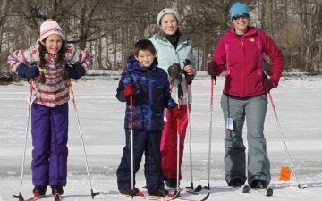 Family and friends cross-country skiing at Snow Days event