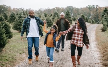 Family walking outside during the holiday season