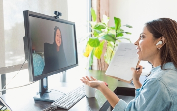 Woman on a telehealth call on her computer