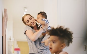 Mom wit kids talking on the phone