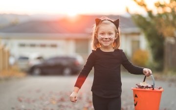 Family activity girl trick or treating halloween