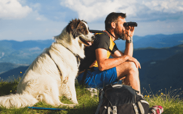 Man and dog hiking in Vermont