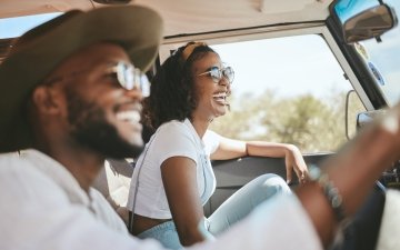 Couple driving with sunglasses
