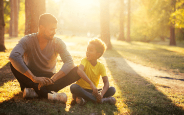 Father and son sitting together and talking