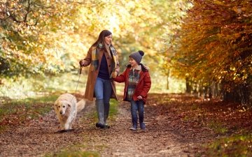 Family walking during the fall