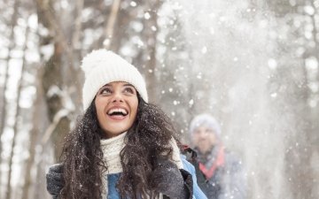 Woman hiking in the woods in winter
