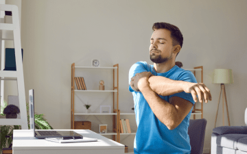 man stretching while sitting
