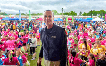 Don George poses in front of a crowd at a GOTRVT event