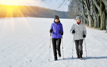 two women walking in the winter