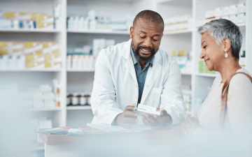 Pharmacist talks with a customer