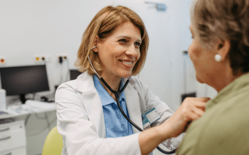 Doctor listening to a patient's chest with a stethescope