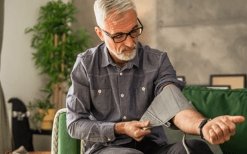 man testing his blood pressure