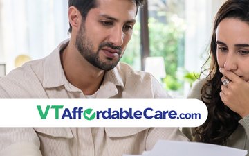 Man and woman looking at a bill