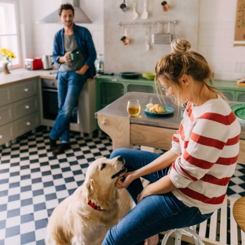 iStock-1179643709-2000sq.jpg Couple in kitchen with dog