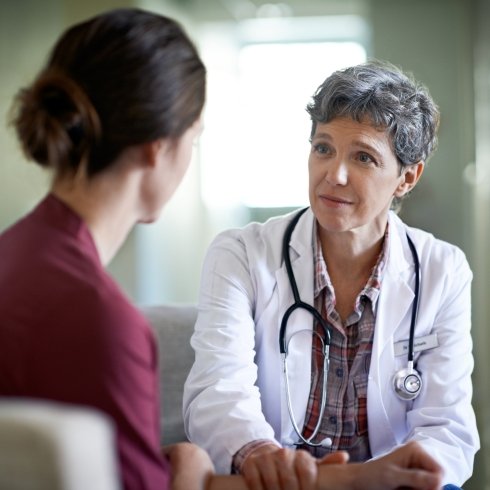 Doctor and patient having serious health conversation