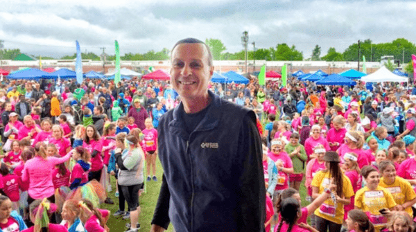 Don George poses in front of a crowd at a GOTRVT event