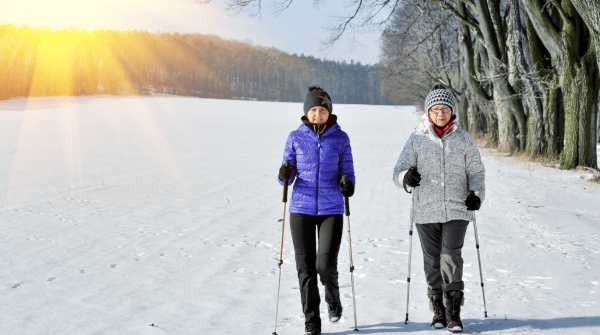 two women walking in the winter