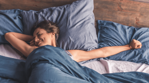woman stretching after sleeping