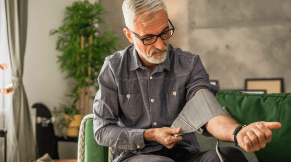 man testing his blood pressure