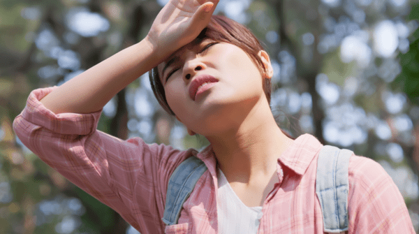 woman overheating while hiking