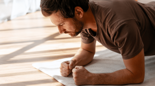 man doing plank at home