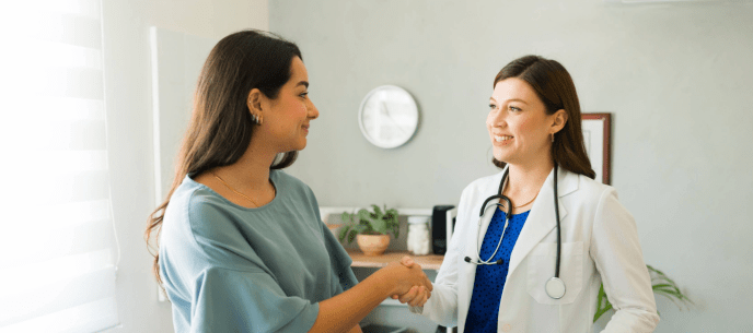 patient shaking hands with her new doctor