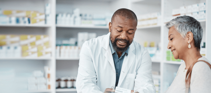 Pharmacist talks with a customer