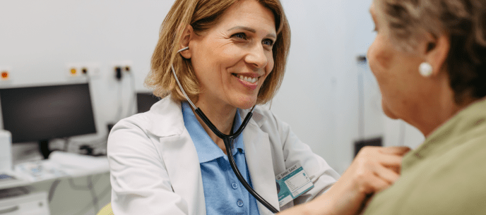 Doctor listening to a patient's chest with a stethescope