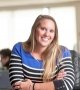 woman smiling at desk