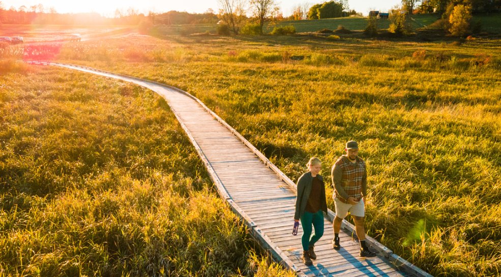 a couple walking on boardwalk of Vermont