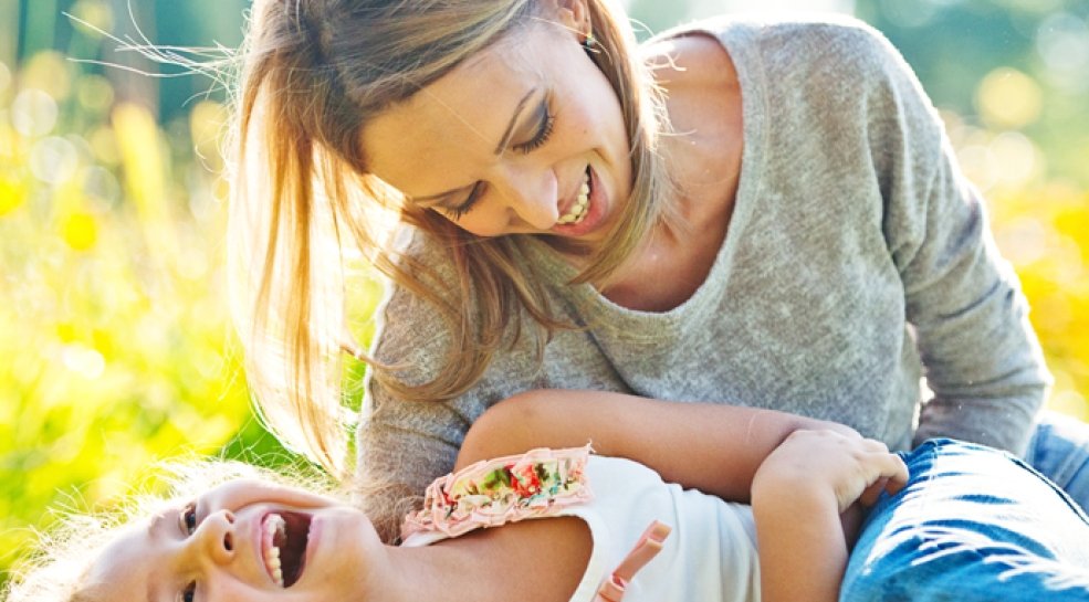 Woman playing with child