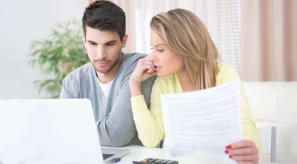 A couple reviewing their Summary Health Plan Payments document
