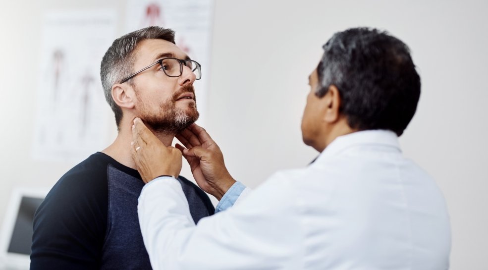 Male patient at check up with his doctor