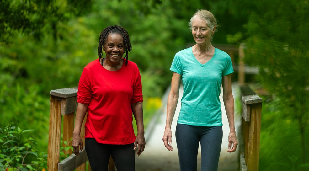 Two women walking on a path in Vermont