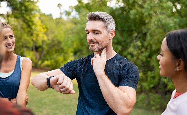 Man Checking his Pules