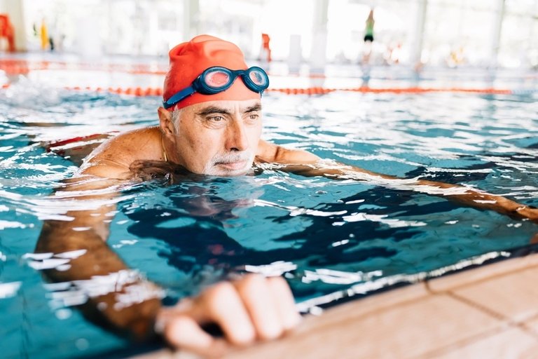 Elderly man swimming