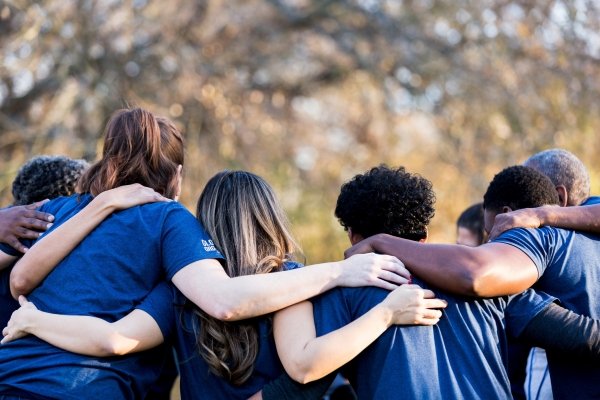 Group of young people hugging