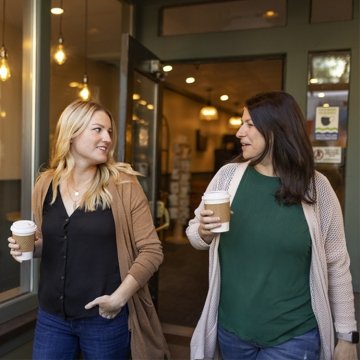Two females having coffee
