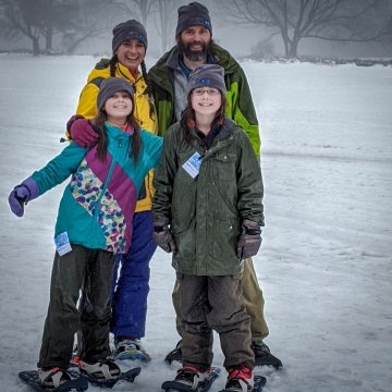 family snowshoeing at Snow Days Event