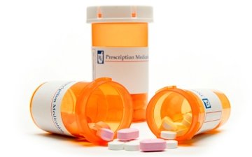 prescription medication bottles and pills