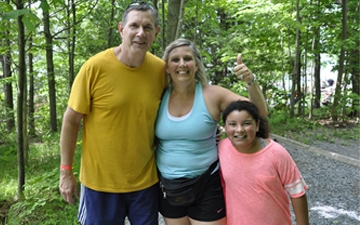 Family posing for a picture during Mountain Days event