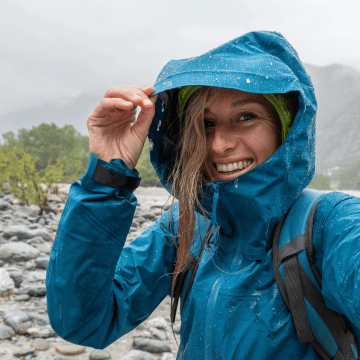 woman taking a selfie while hiking in the rain